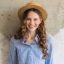 https___elements.envato.com_young-attractive-stylish-woman-sitting-at-wall-bac-T34CKY3 (1)